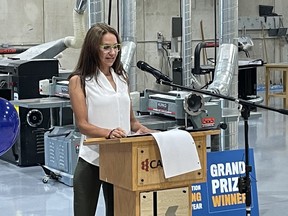 Michelle Mulder addressing the audience at Canadore's Commerce Court after winning major roofing award.