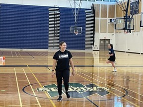 Nipissing Laker's  women’s basketball coach Rachel Van Woezik watches optional team drills at the Robert J. Surtees Student Athletic Centre.
