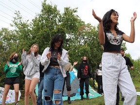 Sophia Mathur leads Fridays For Future youth climate activists through a dance to the song "In The Anthropocene" by Nick Mulvey. Mia Jensen