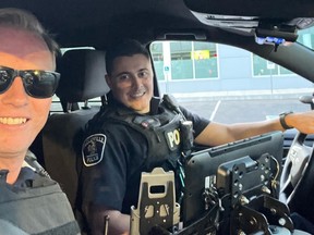 From left, Bay of Quinte MP Ryan Williams is pictured on a ride along with Belleville Police Const. Jordan Wells. Williams lauded the new IMPACT program which, when needed, pairs a mental-health worker with officers on assistance calls to defuse incidents.