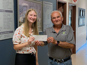 Angelo Ligori, right, presents Charlotte Sellner with the 2022 Angelo Ligori Engineering Scholarship. Sellner is studying engineering at Queen's University in the fall. (Handout/Postmedia Network)