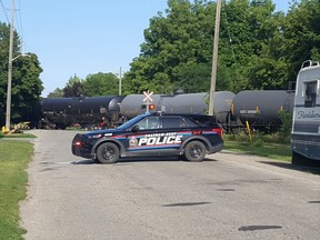 Two people were taken to hospital after a crash involving a train and a vehicle on Colborne Street in Chatham on Saturday afternoon. (Trevor Terfloth/The Daily News)