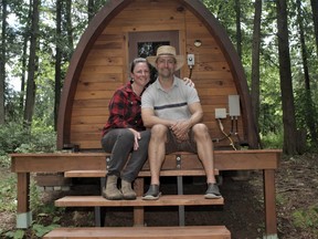 Laura and Rene Dubois are the former owners of the White Owl Bistro in North Bay. Life after the restaurant business includes creating an Airbnb on their 50 acre property in Chisholm. Part of the Airbnb includes putting up three cabin pods like the one behind the Dubois. The difference is the pictured pod serves as a sauna for the family and is slightly smaller than the three main cabins to come.