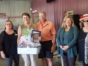 Jeannette Martin, second from left, who has been with the Clinton Horticultural Society for 36 years, received the District Service Award at the Societys annual Flower Show Aug. 19. Pictured from left are District 8 director Karen Redmond, Martin, Mayor Jim Ginn, MPP Lisa Thompson and Horticultural Society president Nancy Scriver. Handout