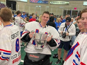 Kaleb Martin of Owen Sound holds the Minto Cup after he backstopped the Whitby Warriors to the nation Junior A lacrosse championship in Brampton, Ontario, on Monday, August 29, 2022.