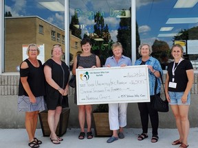 100 Women Who Care Norfolk members (from left) Kathy Caskenette, Beth Redden, Julia Easey, Michelle Grummett and Sue Goble present a $16,500 check to Sarah Rutledge, Simcoe Youth Center director, for Youth Unlimited/YFC Norfolk.  SUBMITTED PHOTO