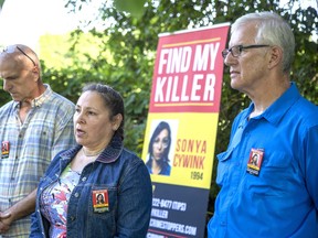 Flanked by retired OPP sergeant Chris Gheysen (left) and retired OPP deputy commissioner John Carson, Meggie Cywink speaks during a press conference at the Iona Prehistoric Earthworks about their quest to find the killer of Meggie's sister, Sonya. Sonya's body was discovered at the site on Aug 30, 1994.  
Derek Ruttan/Postmedia