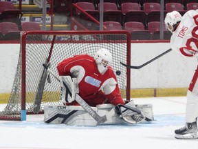 Soo Greyhounds defender Connor Toms gets the puck over the right shoulder of Greyhounds second-round pick Landon Miller during a Team Red vs. Team White scrimmage game at the GFL Memorial Gardens on Tuesday morning.