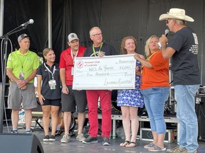 On Aug. 27, the Lucknow and District Kinsmen Club presented a cheque for $5,000 to WES for Youth Online in honour of late musician James Cameron. Third from right, Cameron's sister Britanie Hagen, fourth from right, Cameron's father Ken Cameron. Photo by Kelly Kenny/Lucknow Sentinel.