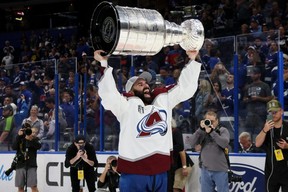 Nazem Kadri #91 of the Colorado Avalanche lifts the Stanley Cup after defeating the Tampa Bay Lightning 2-1 in Game Six of the 2022 NHL Stanley Cup Final at Amalie Arena on June 26, 2022 in Tampa, Florida. (Photo by Bruce Bennett/Getty Images)