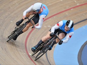Nick Wammes, left, and Ryan Dodyk of Team Canada compete during the men's sprint track cycling 1/8 finals at the Commonwealth Games at Lee Valley Velopark Velodrome on July 31, 2022, in London, England. (Photo by Justin Setterfield/Getty Images)