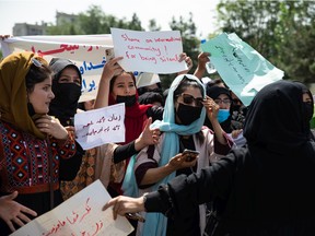 A rare rally by women chanting "Bread, work and freedom," marching in front of the education ministry building, days ahead of the first anniversary of the hardline Islamists' return to power, on August 13, 2022 in Kabul, Afghanistan. The female population have had to quit jobs and young girls after the age of 12 can no longer go to school or complete further education.