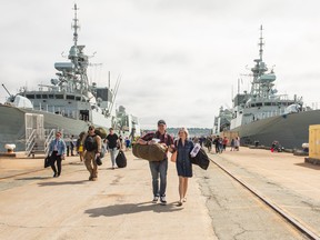 Returning sailors and their family and friends are seen as the HMC Ships Halifax and Montreal return from deployment to NATO's Operation Reassurance at the HMC Dockyard in Halifax on Friday, July 15, 2022. For the first time in eight years, Canadian warships are not involved in either of two NATO naval taskforces charged with patrolling European waters. THE CANADIAN PRESS/Kelly Clark