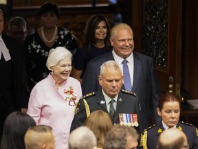 Ontario Lt.-Governor Elizabeth Dowdeswell, left, and Ontario Premier Doug Ford enter the Legislative Chamber before the Throne Speech at Queens Park in Toronto, on Tuesday, August 9, 2022. THE CANADIAN PRESS/Andrew Lahodynskyj