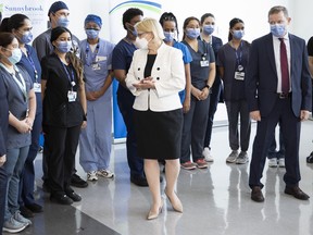 Ontario Health Minister Sylvia Jones turns towards Healthcare workers after making an announcement at Toronto’s Sunnybrook Hospital, Thursday, August 18, 2022. THE CANADIAN PRESS/Chris Young
