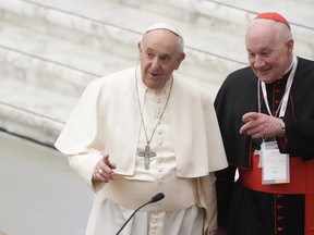 Pope Francis, left, and Cardinal Marc Ouellet arrive at the opening of a 3-day Symposium on Vocations in the Paul VI hall at the Vatican on Feb. 17, 2022. The prominent Quebec cardinal is denying sexual assault allegations contained in a class-action lawsuit that was formally filed this week. THE CANADIAN PRESS/AP, Gregorio Borgia
