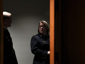RCMP Commissioner Brenda Lucki and deputy commissioner Brian Brennan wait to appear as a witnesses at the Standing Committee on Public Safety and National Security on Parliament Hill, in Ottawa, on Monday, July 25, 2022. THE CANADIAN PRESS/Sean Kilpatrick