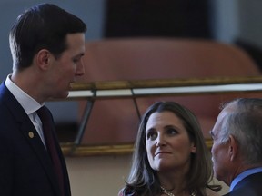 Deputy Prime Minister of Canada Chrystia Freeland, center, and the chief of staff of Mexican President Andres Manuel Lopez Obrador Fernado Romo, listen to White House senior adviser Jared Kushner during an event to sign an update to the North American Free Trade Agreement, at the national palace in Mexico City, Tuesday, Dec. 10. 2019.THE CANADIAN PRESS/AP-Marco Ugarte