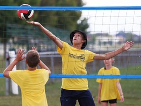 Dante McKaig, 14, tips the ball during a game at the annual Volleyball Kent Camps at St.  Clair College's Chatham Campus HealthPlex in Chatham, Ont., on Friday, Aug.  5, 2022. Mark Malone/Chatham Daily News/Postmedia Network