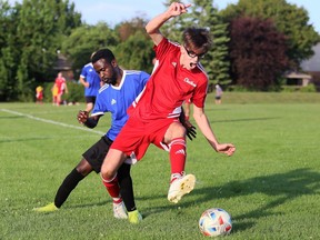 Chatham Express's Stefan Borovicanin, right, battles Lucas Mavinga of African Caribbean United during a Western Ontario Soccer League game at St. Clair College's Chatham Campus Sports Complex in Chatham, Ont., on Saturday, Aug. 27, 2022. Mark Malone/Chatham Daily News/Postmedia Network