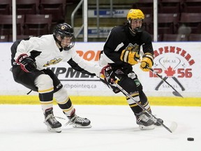 Team Haley's Tyson Doucette, right, shoots while being defended by Team Staubitz's Trent Ledrew during a morning scrimmage at the Sarnia Sting's orientation camp at Progressive Auto Sales Arena in Sarnia, Ont., on Tuesday, Aug. 30, 2022. Mark Malone/Chatham Daily News/Postmedia Network