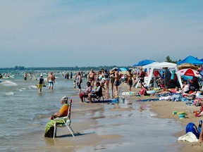 Thousands of visitors crowded the beach  Saturday, Aug. 6, 2022 at Sauble Beach, Ont. on a perfect summer beach day. (Scott Dunn/The Sun Times/Postmedia Network)