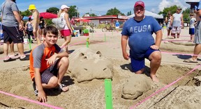Everett Chilian, 13, left, and Eric Freitag won first prize in the annual Sandfest sand sculpture competition in Sauble Beach, Ont.  Saturday, August 6, 2022. (Scott Dunn/The Sun Times/Postmedia Network)
