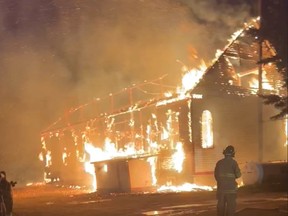 Firefighters in Fort Chipewyan respond to a fire at the Nativity of the Blessed Virgin Roman Catholic Church in a screenshot from a Facebook Live video shot by Chief Allan Adam on Thursday, August 25, 2022.