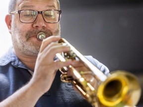 Shawn Spicer on trumpet was one of the London Symphonia musicians who played a free concert on Market Lane in downtown London from 11:30 a.m. to 1:30 p.m. on Wednesday August 10, 2022. (Mike Hensen/The London Free Press)