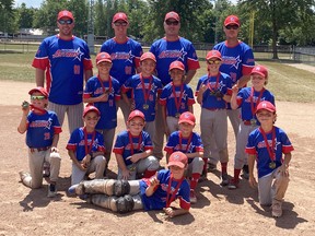 Members of the Mitchell Major Rookie (9U) OBA baseball team celebrate their Western Ontario Baseball Association (WOBA) tier 1 championship on their home field July 31, a 13-10 win over Saugeen Shores. Back row (left): Coaches Jason Crawford, Dave Chessell, Jeff Havens and Chad Furtney. Middle row (left): Boston Bambrough, Myles Havens, Gage Wicke, Aiden Crawford and Owen Dietrich. Front (left): Liam Chessell, Leo Furtney, Nathan Walt, Denver Verberne and Brooks Ward. Lying is Jack Laverty. Brock Czjakowski was absent. SUBMITTED