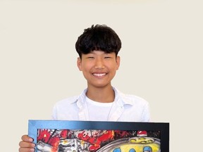 Joseph Lee stands with his piece, "Surgery on the Road," which he earned $3,000 USD for by becoming a finalist in Toyota's international Dream Car Art Contest. Photo courtesy of Hanan Ismail
