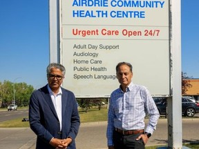 Irfan Sabir, NDP MLA for Calgary-Bhullar-McCall, left, and Joe Ceci, Alberta NDP Municipal Affairs Critic stand the Airdrie Urgent Care centre at Ceci's press conference on August 12. Photo courtesy of Dave DeGagne/Alberta NDP