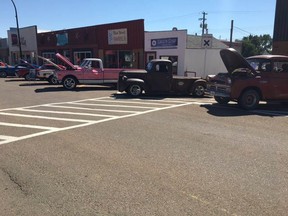 Some vintage pickups sit parked on the street for the Show and Shine on August 13. Photo courtesy of Mark Fecho