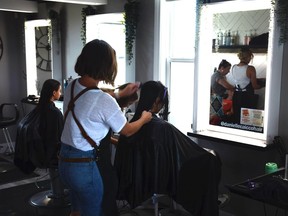 Kids get their discounted back to school trims at Hair Lounge, as part of the business's $10 Haircuts for the Airdrie Food Bank event on August 28.