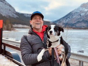 Tony Smith, who is the Managing Director for Grizzly Mountain Events, holds his border collie Bella.