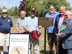 Orland French , past president, Hastings County Historical Society;  left of plaque,  Gerry Fraiberg, director of society and emcee;  Sean Scully, historian; Todd Smith, MPP and Mayor Jim Harrison. JACK EVANS