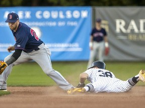 Jakob Newton of the London Majors steals second well ahead of the throw to Brantford shortstop Jon Dziomba during the first inning of their Friday night Intercounty Baseball League game at Labatt Park in London, Ont. London won the game 20-4. Mike Hensen/Postmedia Network