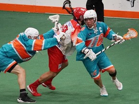 Cody Jamieson of the Six Nations Chiefs works around a pick in Game 3 of the Major Series Lacrosse championship series at Iroquois Lacrosse Arena against the Peterborough Lakers.