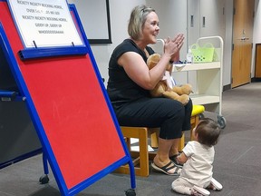 Brantford Public Library technician Kim Thomas leads Baby and Me Storytime.