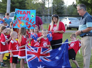 Front of Yonge Mayor Roger Haley (right) chats with tyke players on the FOY Firefighters squad - Team Austraila - before cutting the ribbon to start the World Cup Parade in Mallorytown on Friday evening. The minor soccer parade returned after being sidelined for two years by COVID-19.
Tim Ruhnke/Postmedia Network