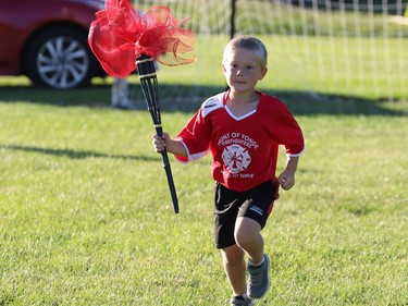 Brayden Hoare of the Front of Yonge Firefighters tyke team completes the final leg of the torch relay at the end of the 2022 World Cup Soccer Parade on Friday evening.
Tim Ruhnke/The Recorder and Times