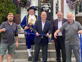 Taking part in the ribbon-cutting at the unveiling of the revitalized Town Square in Gananoque on Friday, Aug. 26: Coun. Dave Anderson, Town Crier Brian Mabee, MPP Steve Clark, Coun. Dave Anderson and Gananoque Mayor Ted Lojko. 
Keith Dempsey/Local Journalism Initiative Reporter/Postmedia Network
