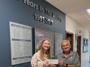 Angelo Ligori (right) presents Charlotte Sellner with the 2022 Angelo Ligori Engineering Scholarship. Sellner is studying engineering at Queen's University in the fall. (Handout/Postmedia Network)