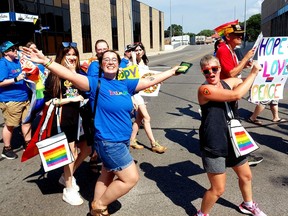 Sam Erdelyi, left, and Amanda Burk, were among the many participants in the Chatham-Kent Pride Parade held in downtown Chatham on Saturday.  PHOTOEllwood Shreve/Chatham Daily News.