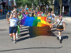 A large Pride flag was carried by many participants in the Chatham-Kent Pride Parade held in downtown Chatham on Saturday.  PHOTOEllwood Shreve/Chatham Daily News.