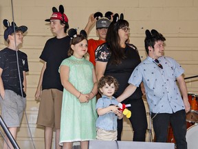 Three-year-old Jack Robinson, siblings (from left) Lexton, Lucas, Lillian and Logan, and parents Jeanine Robitaille and James Robinson were presented a Help A Child Smile trip to Give Kids the World in Orlando, Florida on Saturday, August 13 at the Canjam fundraising concert in Brantford.
