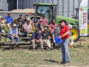 Agronomist Peter Johnson talks about soil compaction with farmers during a day-long seminar at Snobelen Farms near Brantford.