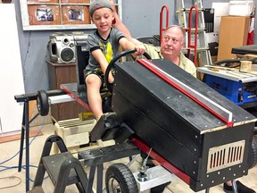 Five-year-old Mason Finucane of Brantford got help from his grandfather John Wootton to build a soap box derby car that the youngster will race on Labor Day Monday in Brantford.SUBMITTED PHOTO