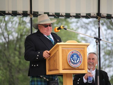 Games president Eric Metcalfe at the podium, with master of ceremonies Bob Clear at right. Photo on Saturday, July 30, 2022, in Maxville, Ont. Todd Hambleton/Cornwall Standard-Freeholder/Postmedia Network