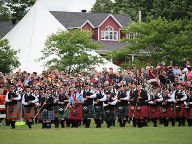 Some of the bands emerging from the southeast gate, for the Massed Pipe Bands at the Glengarry Highland Games. Photo on Saturday, July 30, 2022, in Maxville, Ont. Todd Hambleton/Cornwall Standard-Freeholder/Postmedia Network